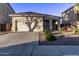 House exterior with a two-car garage and landscaping at 12418 W Pima St, Avondale, AZ 85323