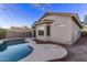 View of home's back and side, showcasing the pool at 12418 W Pima St, Avondale, AZ 85323