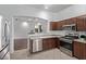 Modern kitchen features stainless steel appliances and wood cabinets at 12418 W Pima St, Avondale, AZ 85323