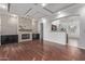 Bright living room with hardwood floors and a fireplace at 12418 W Pima St, Avondale, AZ 85323