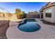 Relaxing kidney-shaped pool in the backyard at 12418 W Pima St, Avondale, AZ 85323