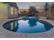 Inviting kidney-shaped pool with surrounding patio at 12418 W Pima St, Avondale, AZ 85323