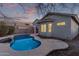 Relaxing kidney-shaped pool with a spa in the backyard at 12418 W Pima St, Avondale, AZ 85323