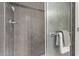 Shower with hexagon tile and glass door at 12418 W Pima St, Avondale, AZ 85323