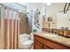 Guest bathroom with tub, shower, and granite countertop at 12736 W Auburn Dr, Peoria, AZ 85383