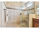 Bathroom with a large shower, built-in seat, and tiled walls at 12736 W Auburn Dr, Peoria, AZ 85383