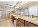 Spa-like bathroom with double vanity, large shower, and tiled floors at 12736 W Auburn Dr, Peoria, AZ 85383