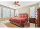 Main bedroom with a king-size bed, dresser, and ceiling fan at 12736 W Auburn Dr, Peoria, AZ 85383