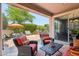 Covered patio furniture with access to backyard at 12736 W Auburn Dr, Peoria, AZ 85383