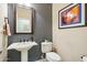 Stylish powder room featuring a pedestal sink and elegant decor at 12736 W Auburn Dr, Peoria, AZ 85383