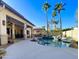 Inviting backyard with a sparkling pool, spa, and covered patio at 12762 W Vista Paseo Dr, Litchfield Park, AZ 85340