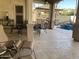 Outdoor kitchen, pool, and covered patio with seating at 12762 W Vista Paseo Dr, Litchfield Park, AZ 85340