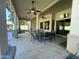 Spacious covered patio with dining area and ceiling fans at 12762 W Vista Paseo Dr, Litchfield Park, AZ 85340