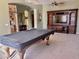 Spacious game room featuring a pool table and an entertainment center at 12762 W Vista Paseo Dr, Litchfield Park, AZ 85340