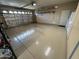 Well-organized garage offering extra storage space and epoxy flooring at 12762 W Vista Paseo Dr, Litchfield Park, AZ 85340