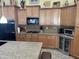 Kitchen with granite counters and stainless steel appliances at 12762 W Vista Paseo Dr, Litchfield Park, AZ 85340