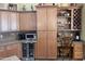 Well-equipped kitchen with wine cooler and built-in desk at 12762 W Vista Paseo Dr, Litchfield Park, AZ 85340