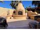 Charming outdoor fireplace with seating area perfect for gatherings at 12762 W Vista Paseo Dr, Litchfield Park, AZ 85340