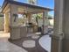 Covered outdoor kitchen with built-in grill at 12762 W Vista Paseo Dr, Litchfield Park, AZ 85340