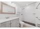 Modern bathroom with gray vanity and a marble shower at 1312 E Colter St, Phoenix, AZ 85014