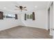 Bright bedroom with ceiling fan and wood-look flooring at 1312 E Colter St, Phoenix, AZ 85014