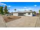 Single story home with attached garage and front yard at 1312 E Colter St, Phoenix, AZ 85014