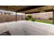 Covered patio with ceiling fans and grassy backyard at 13292 W Statler St, Surprise, AZ 85374