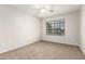 Spacious bedroom with carpeted floor and large window at 13292 W Statler St, Surprise, AZ 85374