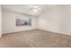 Spacious bedroom with carpeted floors and ceiling fan at 13292 W Statler St, Surprise, AZ 85374