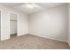 Bright bedroom with carpeted floor and walk-in closet at 13292 W Statler St, Surprise, AZ 85374