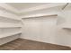 Large closet with shelves and hanging rods at 13292 W Statler St, Surprise, AZ 85374