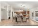 Virtually staged dining area with table and chairs at 13292 W Statler St, Surprise, AZ 85374