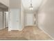 Bright and airy entryway with tile floors and neutral colors at 13292 W Statler St, Surprise, AZ 85374