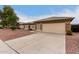 House exterior showcasing a two-car garage and well-maintained yard at 13292 W Statler St, Surprise, AZ 85374