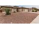 Front yard view of a single-story house with rock landscaping at 13292 W Statler St, Surprise, AZ 85374