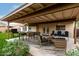 Covered patio staged with outdoor furniture, creating a relaxing space at 13292 W Statler St, Surprise, AZ 85374