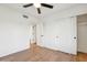 Spacious bedroom with ceiling fan and sliding door to closet at 14402 N 45Th St, Phoenix, AZ 85032