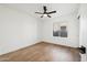 Light-filled bedroom featuring wood flooring and a ceiling fan at 14402 N 45Th St, Phoenix, AZ 85032