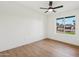 Bright bedroom with ceiling fan and window overlooking the street at 14402 N 45Th St, Phoenix, AZ 85032