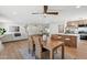 Open concept dining area with wood table and wicker chairs at 14402 N 45Th St, Phoenix, AZ 85032