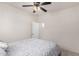 Cozy bedroom with a double bed and access to a nearby bathroom at 14518 W Port Royale Ln, Surprise, AZ 85379