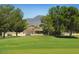 Single story home with mountain views and large trees at 1621 E Firestone Dr, Chandler, AZ 85249