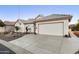 House exterior with a two-car garage and well-maintained landscaping at 1621 E Firestone Dr, Chandler, AZ 85249