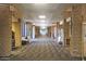 Long hallway with stone walls and carpeted floors at 1621 E Firestone Dr, Chandler, AZ 85249