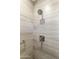 Shower with updated fixtures and neutral colored tile at 1621 E Firestone Dr, Chandler, AZ 85249