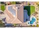 Aerial view of house with solar panels, pool, and landscaped yard at 1684 E Coconino Dr, Chandler, AZ 85249