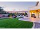 Spacious backyard features a large patio, outdoor swing, and a pristine pool area at 1684 E Coconino Dr, Chandler, AZ 85249
