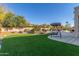 Artificial turf backyard with swing and patio at 1684 E Coconino Dr, Chandler, AZ 85249