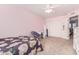 Bright bedroom with a floral comforter and built-in closet at 1684 E Coconino Dr, Chandler, AZ 85249