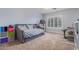 Cozy bedroom featuring a daybed, built-in shelving, and a workspace at 1684 E Coconino Dr, Chandler, AZ 85249